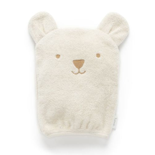 Fluffy beige bath mitt with bear ears and face on a white background