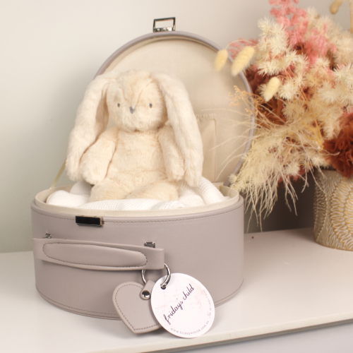 grey keepsake box open with an ivory plush bunny sitting inside with dried flower arrangement next to
