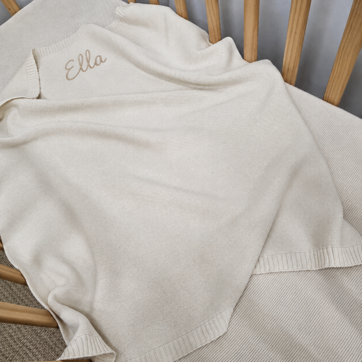 Knitted baby bassinet blanket with personalisation embroidery