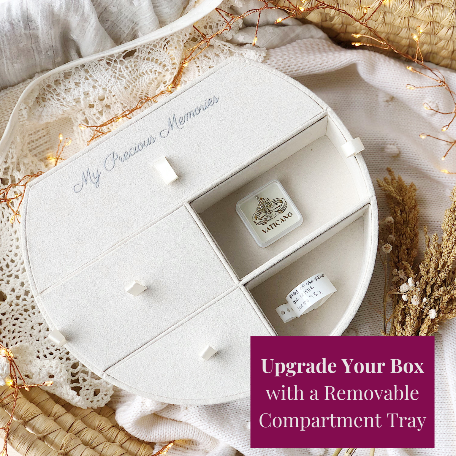 White suedette removable compartment tray on a decorative surface with lights and flowers.