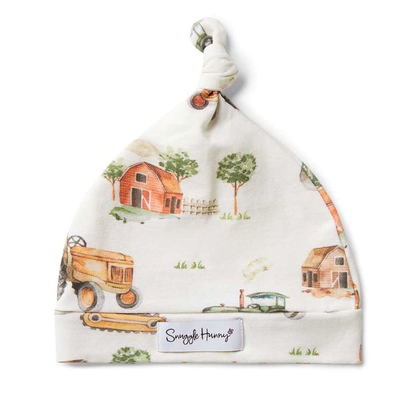 Baby hat with farm-themed design and 'Snuggle Hunny' label on a white background