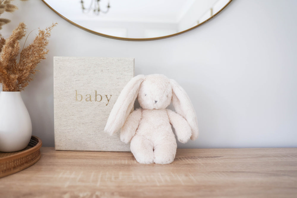 cream blanket in cane baby cot