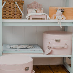 childrens bedroom shelves showing pink keepsake box on shelf next to childrens books and toys