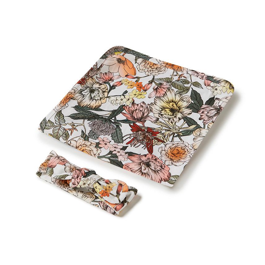 Floral-patterned wrap and headband set on a white background