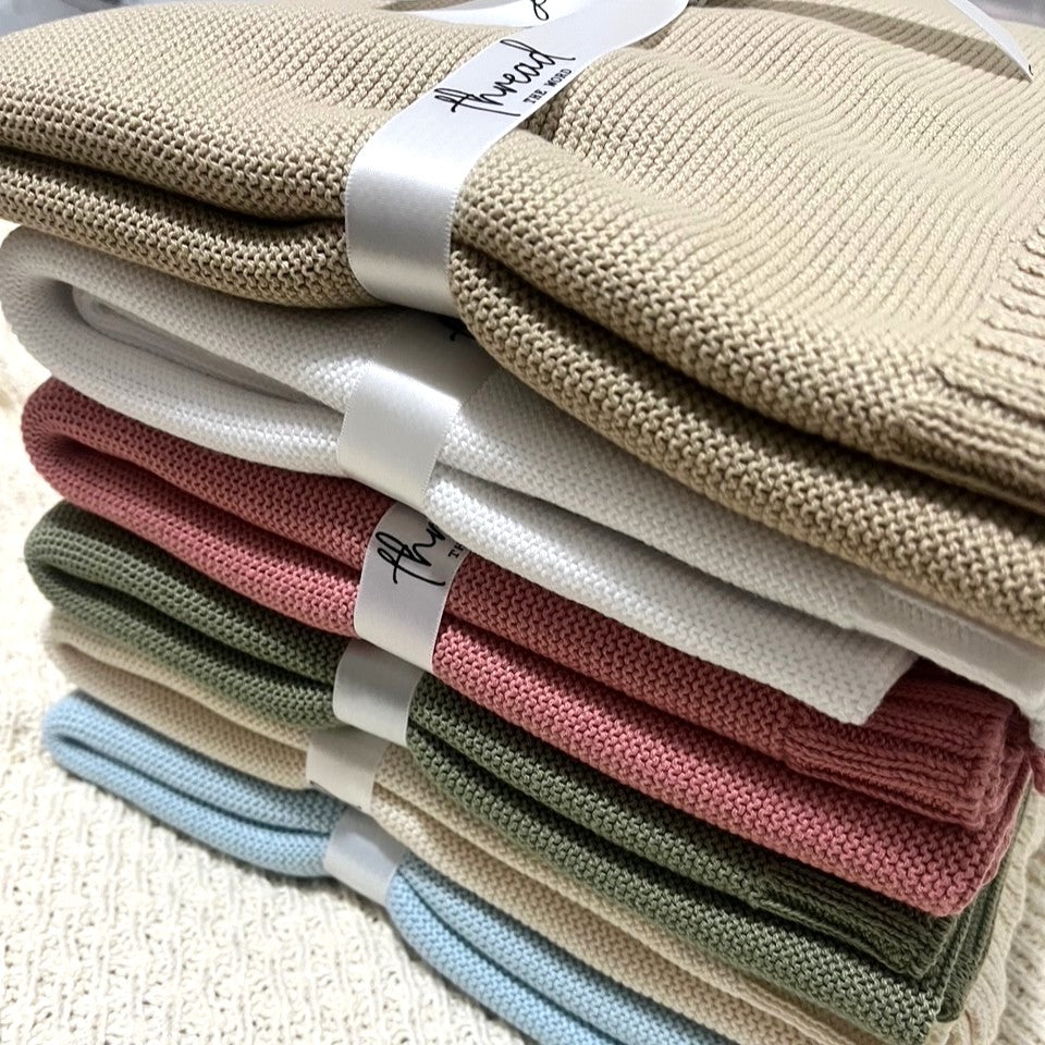 stack of knit baby blankets