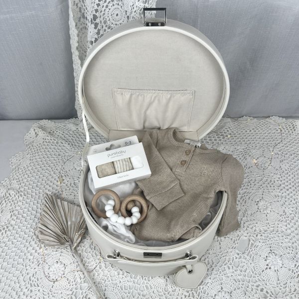 neutral baby items - bodysuit, socks and teether in a keepsake box