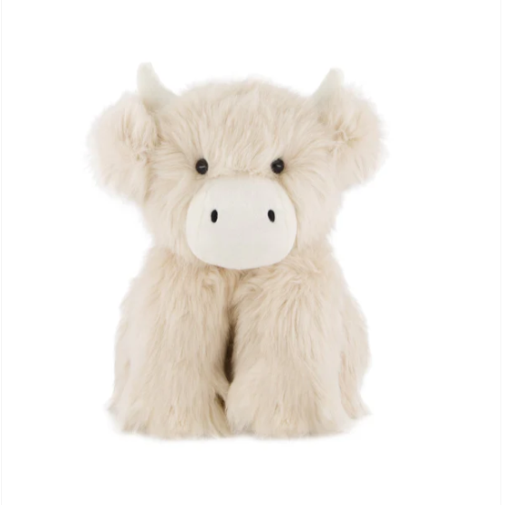 Plush toy highland cow on a white background