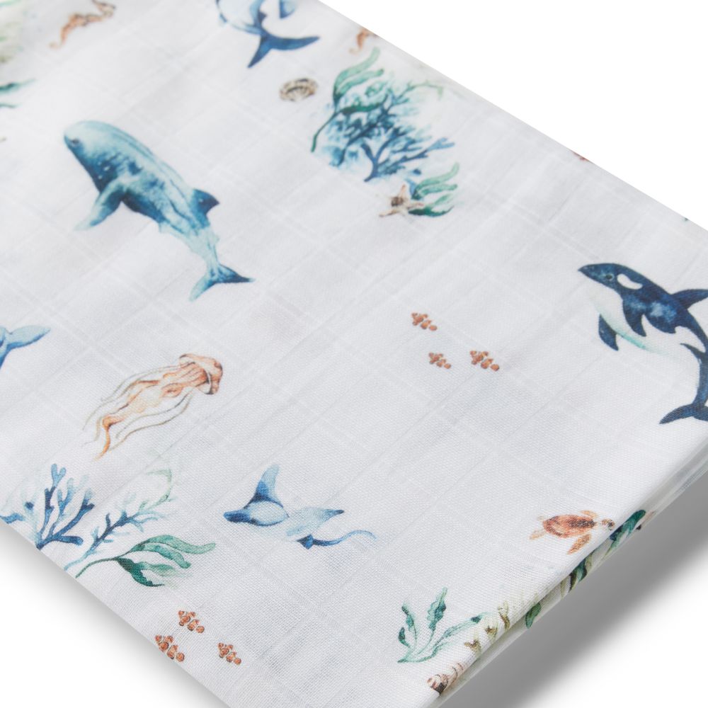Fabric with whale and coral pattern on a white background