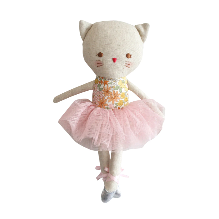 Cat-shaped plush toy with a floral top and pink tutu on a white background