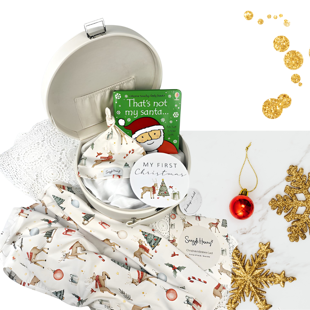 Collection of Christmas-themed items including a book, cards, and decorative elements on a white background.