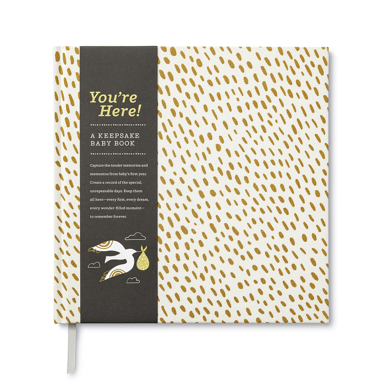 A keepsake baby journal. Cloth bound, hardcover with a white cover with gold flecks