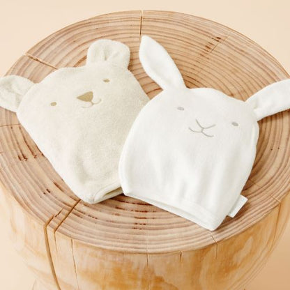 bunny bath mitt next to bear bath mitt