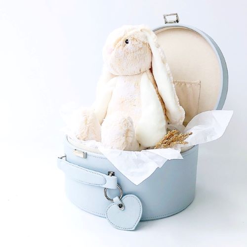 opened grey keepsake box with a cream bunny sitting in it