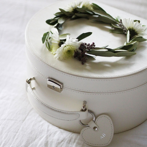 cream keepsake box closed with a flower wreath on top