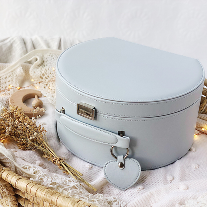 grey keepsake box with silver closure and a heart shaped key tag