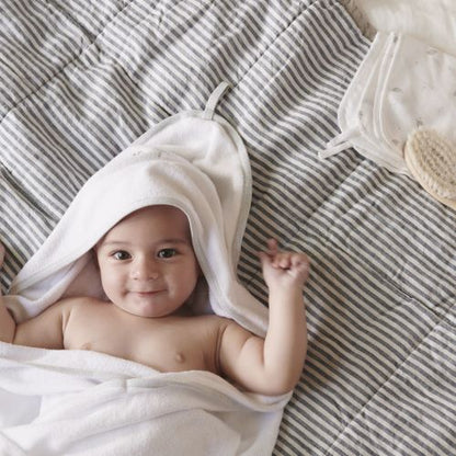 baby wrapped in vanilla hooded towel
