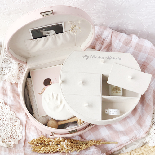 Keepsake box showing removable compartment tray and space underneath for storage of larger keepsakes