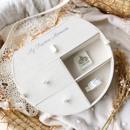 Compartment tray for keepsake box showing open compartments with keepsakes inside