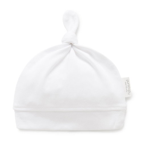 white baby hat with knot tie at the top
