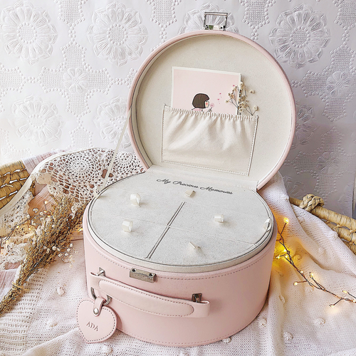 pink keepsake box with lid open showing compartment tray insert inside