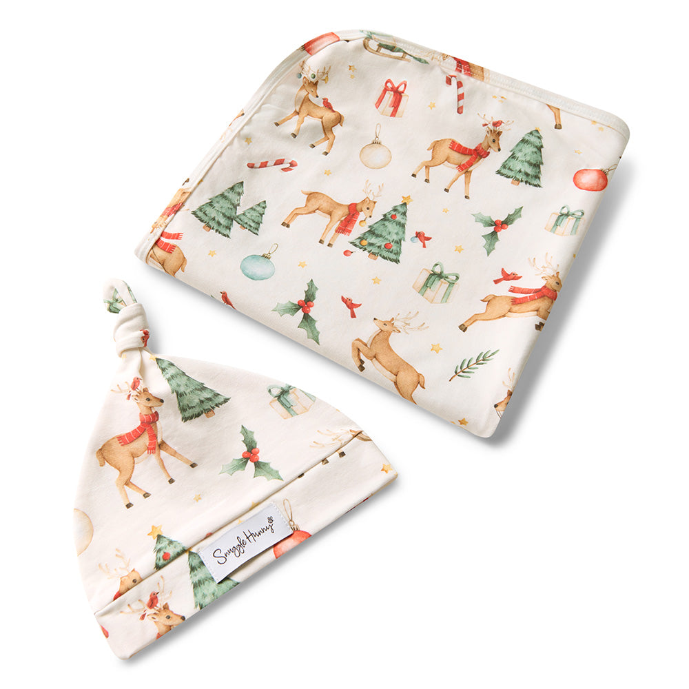 Baby hat and blanket set with Christmas-themed design on a white background
